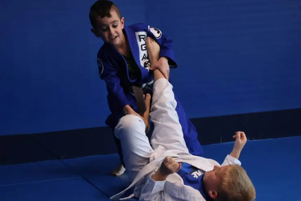 Students of the Renzo Gracie Latham kids 7-12 age group drilling during class