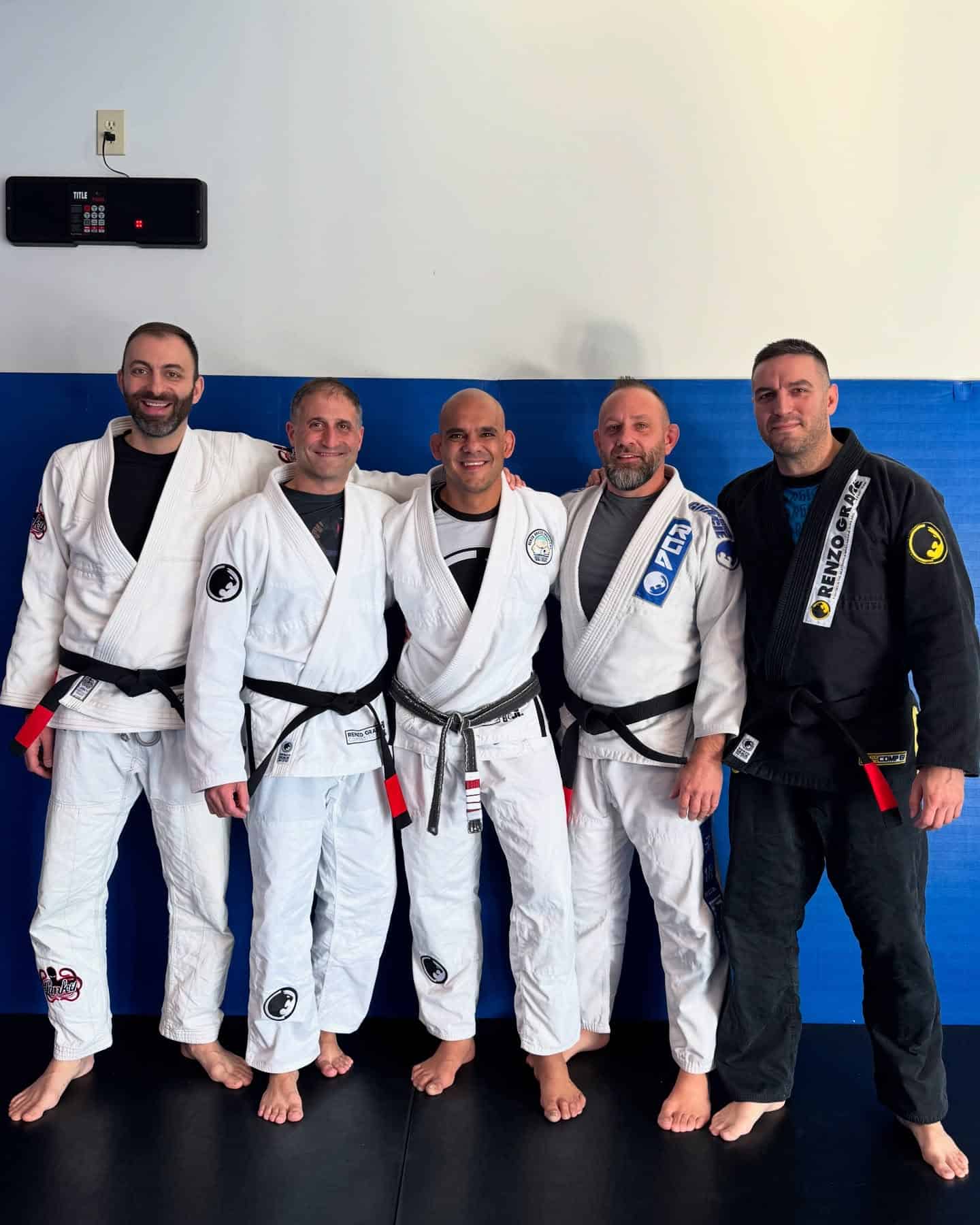 Group photo from Renzo Gracie Latham's black belt ceremony. In the Image is Bruno Tostes, and 4 other blackbelts, including the Chief of Police James Gerace from Colonie New York.